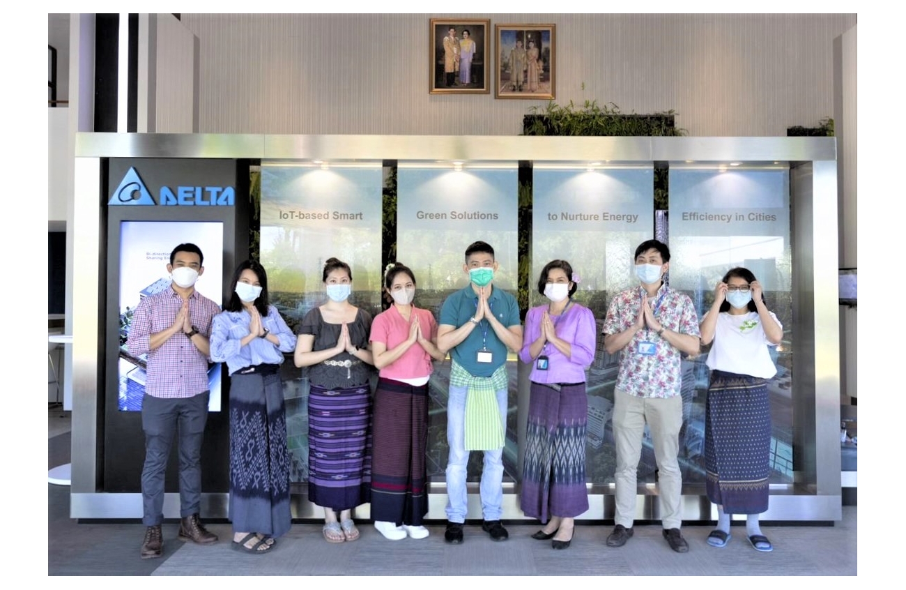 Delta Thailand 360 Editorial Team celebrating the Loy Krathong festival in traditional Thai costumes